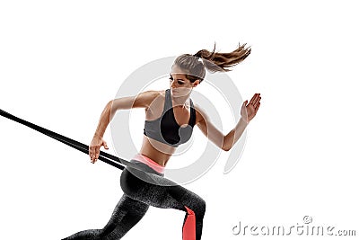 Woman exercising fitness resistance bands in studio silhouette isolated on white background Stock Photo