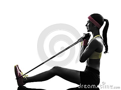 Woman exercising fitness workout resistance bands silhouette Stock Photo