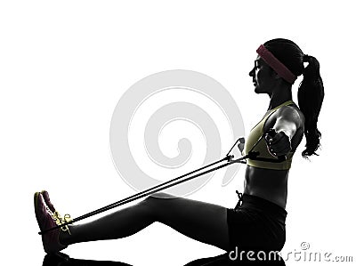 Woman exercising fitness workout resistance bands silhouette Stock Photo