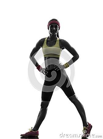 Woman exercising fitness workout standing silhouette Stock Photo