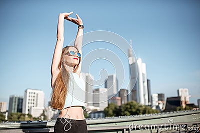 Woman exercising in Frankfurt city Stock Photo