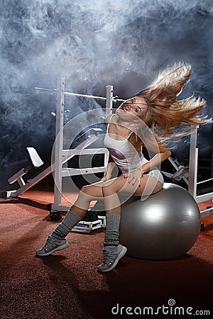 Woman exercising Pilates ball Stock Photo