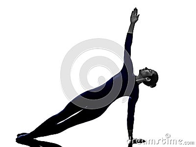 Woman exercising Vasisthasana side plank pose yoga silhouette Stock Photo