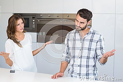 Woman explaining man by table Stock Photo