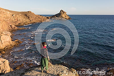 Woman exploring Spanish coastline Stock Photo
