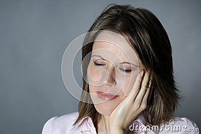 Woman expressing dental pain Stock Photo