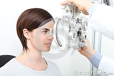 Woman eyesight measurement with optical phoropter Stock Photo