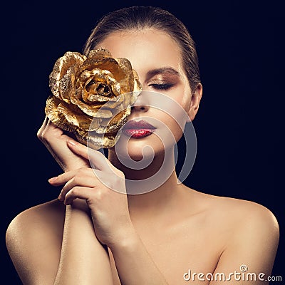 Woman Face with Golden Flower Rose on Face, Fashion Model Beauty Makeup Portrait Stock Photo