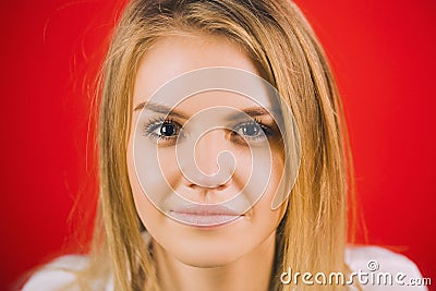 Woman face young beautiful healthy skin portrait. Calm female with bright hair looking at camera with smile. Stock Photo