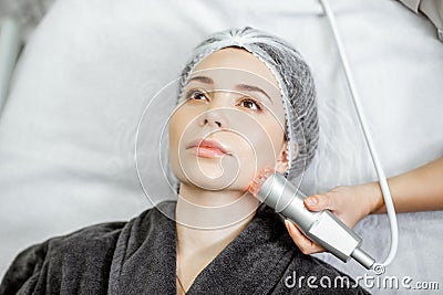 Woman during the facial treatment at the beauty salon Stock Photo