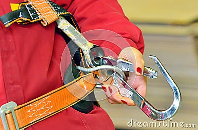 Woman and a fall protection harness Stock Photo