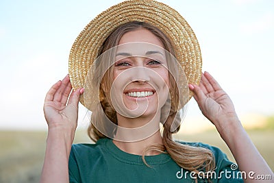 Woman farmer straw hat standing farmland smiling Female agronomist specialist farming agribusiness Happy positive caucasian worker Stock Photo