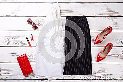 Woman fashion clothes collage on wood, flat lay, top view. Stock Photo