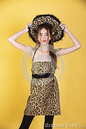 Woman fashion concept. Girl in leopard clothes. Trendy girl with animal print dress. Stock Photo