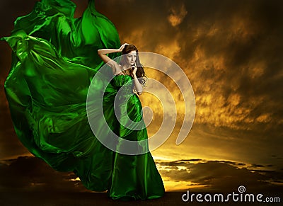 Woman Fashion Dress Fluttering Wind, Green Silk Gown Fabric Stock Photo