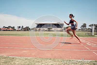 Woman, fast runner and sports on stadium track for marathon training or exercise wellness. Athlete person, motion blur Stock Photo