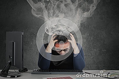 Woman feeling dizzy with smoke over head Stock Photo