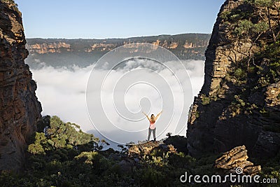 Woman feelings of exhilaration hiking in Blue Mountains Australia Stock Photo