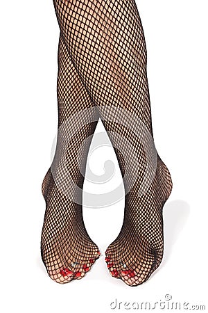 Woman feet with fishnet tights over white Stock Photo