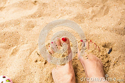 Woman feet on the sand Stock Photo