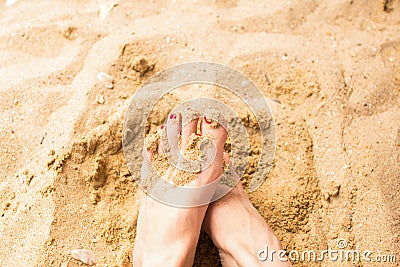 Woman feet on the sand Stock Photo