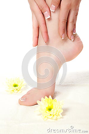 Woman feet standing on towel Stock Photo
