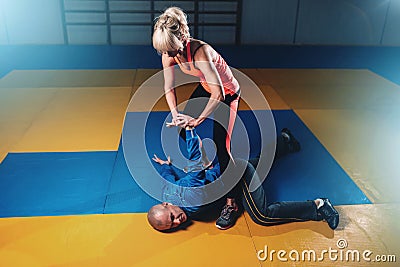 Woman fights with man, self-defense technique Stock Photo