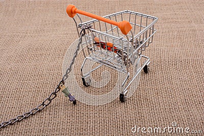 Woman figurine attached to a Shopping cart Stock Photo