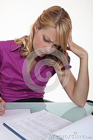 Woman filling in paperwork Stock Photo