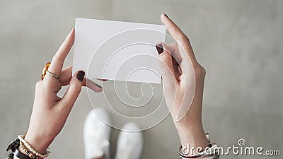 Woman finger both hand holding white card Stock Photo
