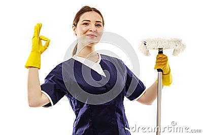 Woman finished cleaning showing a happy thumbs up after a successful spring cleaning. Stock Photo