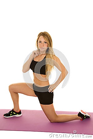 Woman fitness black bra and shorts lunge side Stock Photo