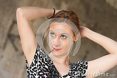 Woman Fixing Hair with Hairpin Stock Photo