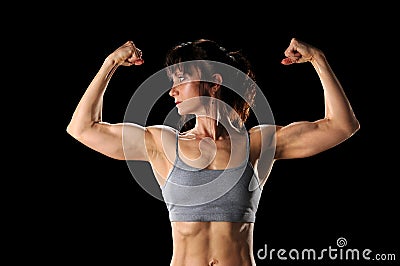 Woman Flexing Muscles Stock Photo