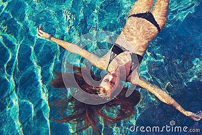Woman Floating in Water Relaxing Stock Photo