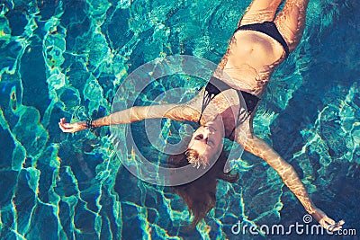 Woman Floating in Water Relaxing Stock Photo