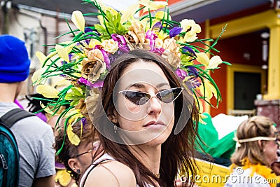 Woman in Flowery Headdress Celebrating Mardi Gras Day in the Marigny Editorial Stock Photo