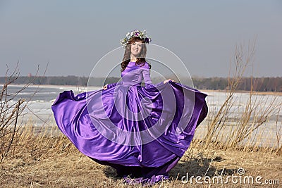 Woman flying lilac dress Stock Photo