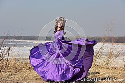 Woman flying lilac dress Stock Photo