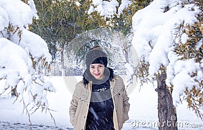 Woman in forest, portrait of a woman in winter forest, cute woman in winter park Stock Photo