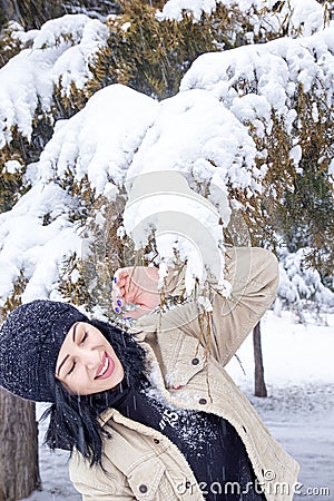 Woman in forest, portrait of a woman in winter forest, cute woman in winter park Stock Photo