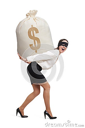 Woman in formal wear and black mask Stock Photo