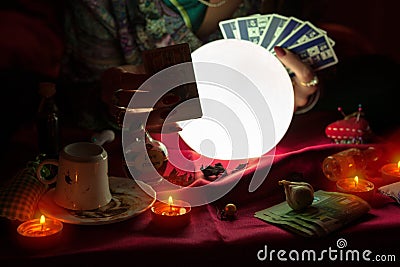 Woman fortune teller holding tarot cards Stock Photo