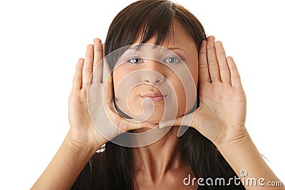 Woman, framing her face with her hands Stock Photo