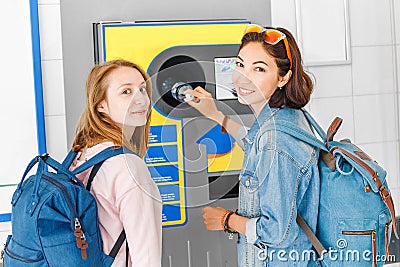 friends together at the reverse vending machine recycle plastic bottles, ecology concept Stock Photo
