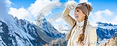 Woman in front of mountain landscape looking into distance Stock Photo