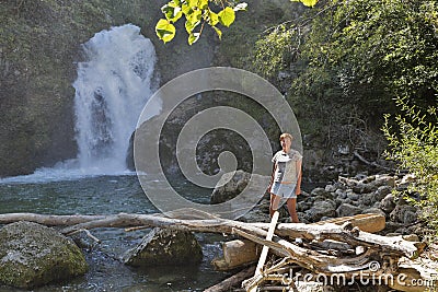 Woman in front of waterfall Sum, Vintgar gorge, Slovenia Stock Photo