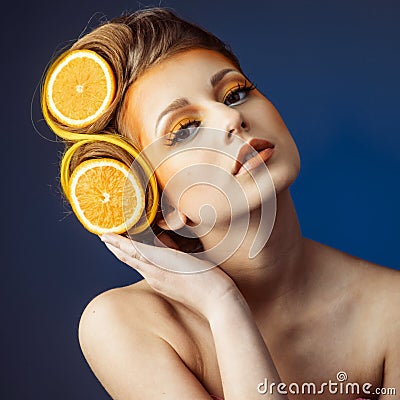 Woman with fruit in hair Stock Photo