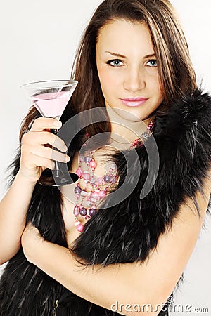 Woman in furs holds Martini Stock Photo