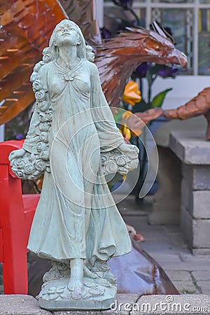 Woman Garden Statue with Lantern Stock Photo
